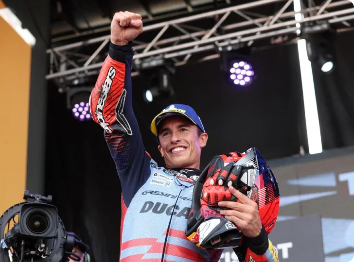 Marc Marquez celebrating after a MotoGP event in his Ducati racing suit